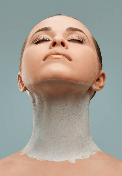 istock woman with clay mask 980175182