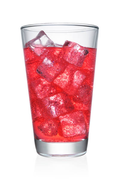 Glass of red soda isolated Glass of carbonated soda soft drink with ice cubes isolated on white background.  Clipping path beverage cup stock pictures, royalty-free photos & images