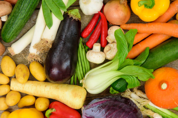 group of fresh vegetables from market - isolated on red still life tomato lemon imagens e fotografias de stock