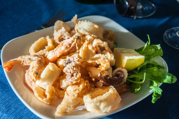 istock Dish of crispy fried squid and shrimps 980186940