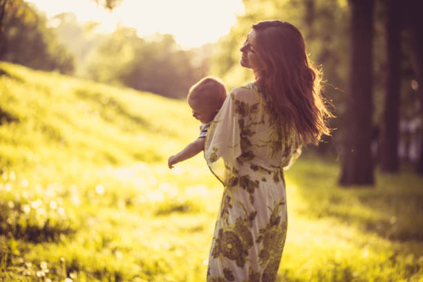 istock Playing at nature. Young mother and her baby boy. 980187046