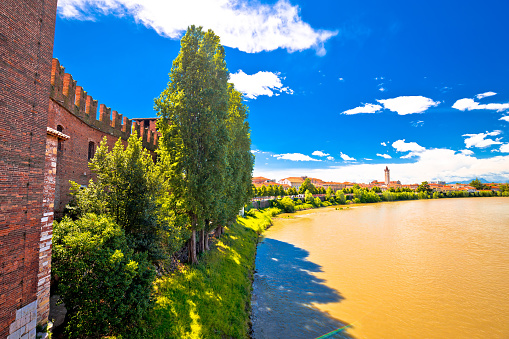 Adige river and Verona riverfront view from Castelvecchio Bridge, famous landmark in tourist destination in Veneto region of Italy