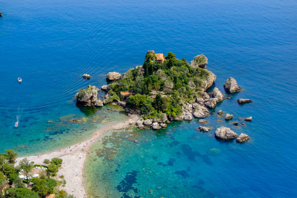 Isola Bella, a small island located within a small bay on the Ionian Sea near Taormina (Sicily, Italy) Isola Bella, a small island located within a small bay on the Ionian Sea near Taormina (Sicily, Italy) isola bella taormina stock pictures, royalty-free photos & images