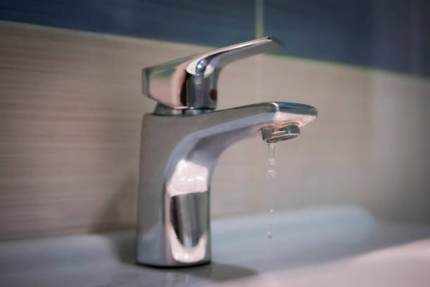 istock Water tap and droplets 980196970