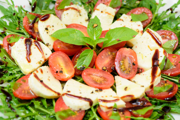istock Italian salad with mozzarella and tomatoes 980197212