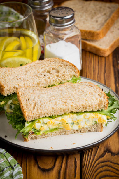 istock Egg salad sandwich, greens, lettuce, delicious healthy Breakfast 980197444