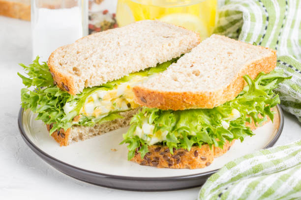 istock Egg salad sandwich, greens, lettuce, delicious healthy Breakfast 980197748