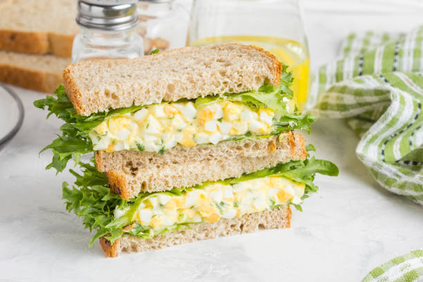 istock Egg salad sandwich, greens, lettuce, delicious healthy Breakfast 980202696