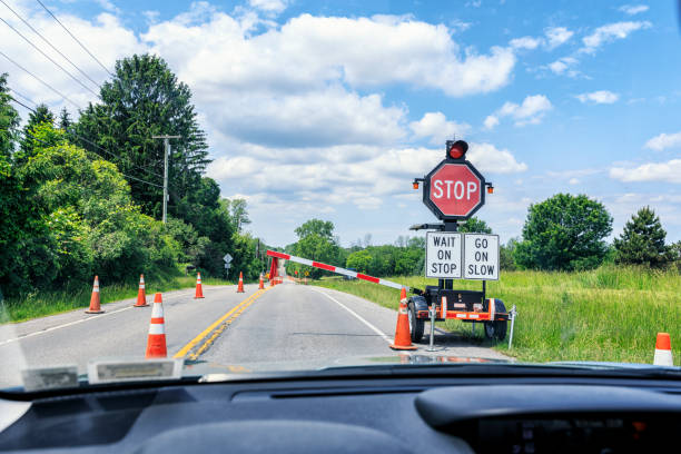 istock Rising Barrier Gate at Road Construction Zone Automated Stop Sign 980228822