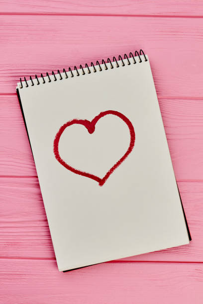istock Heart drawn on paper notepad. 980229386