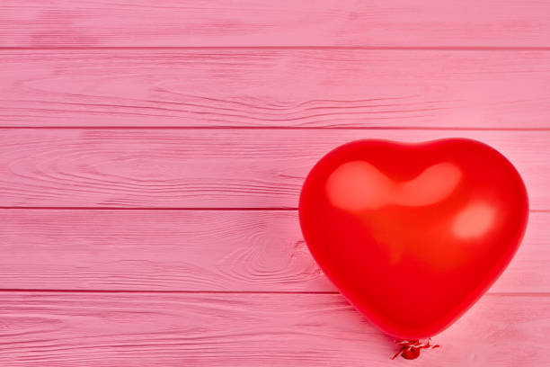 istock Red heart shaped balloon and copy space. 980229684