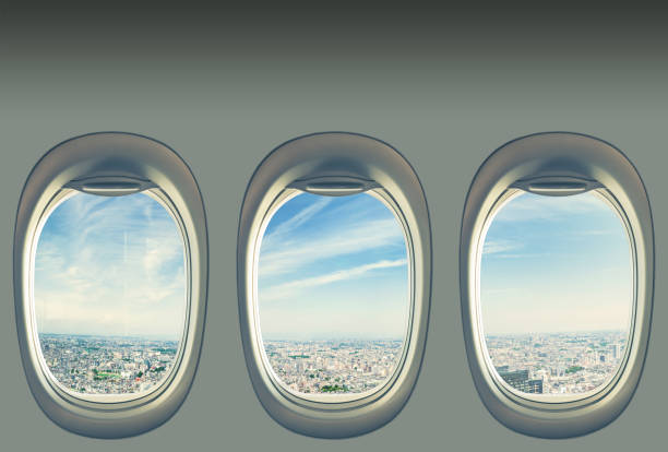 Windows on airplane disembarking after arrival at vacation airport