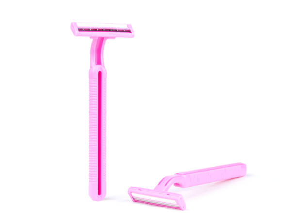 istock Two of Pink lady shavers isolated on white background 980233408