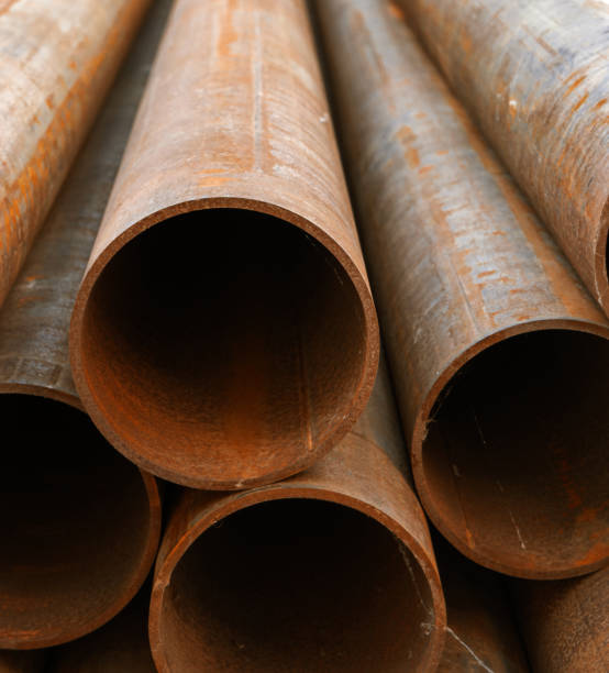 istock Rusty metal pipes in pile 980240128