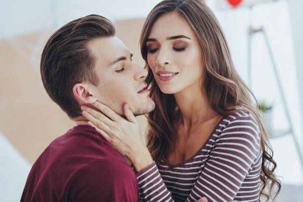 istock Delighted young woman hugging her boyfriend 980240842