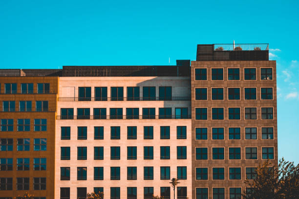 istock brown and orange square office buildings 980241638