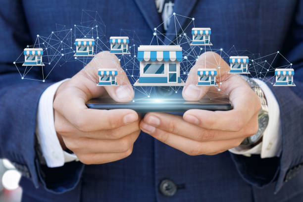 Businessman showing Franchise system on a mobile . Businessman showing Franchise system on a mobile device. mobile phone finance business technology stock pictures, royalty-free photos & images