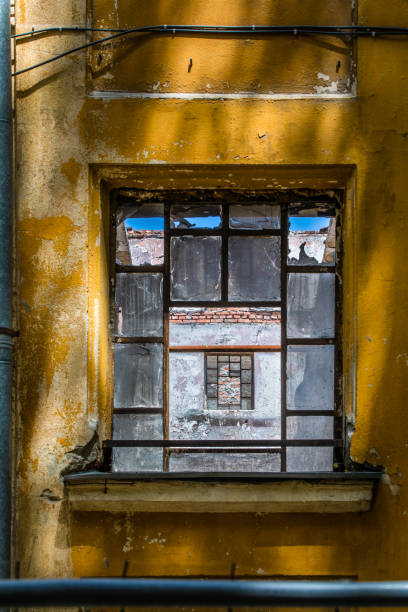 istock Old window in an old building in a gritty setting 980245350