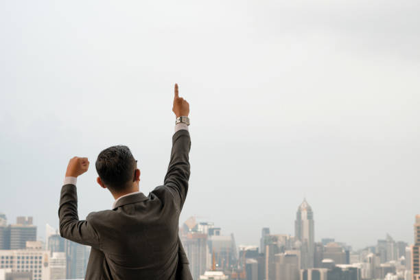 istock Business man pointing finger soft focus background 980248228