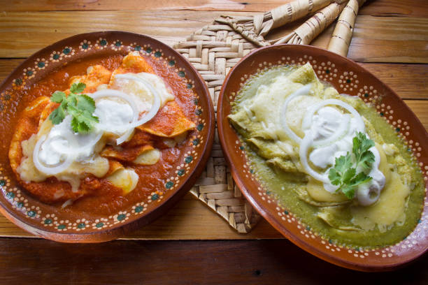 Authentic red and green enchiladas Authentic mexican green and red enchiladas enchilada stock pictures, royalty-free photos & images