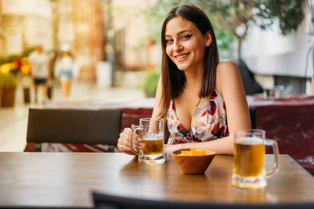 istock Young Woman Drinking Beer 980255390