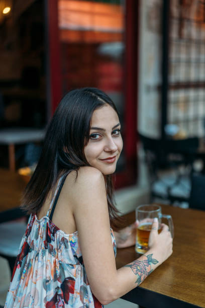 istock Young Woman Drinking Beer 980255800