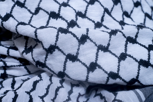 white and black arabic scarf