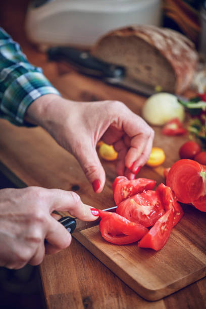 istock Preparing Vegetable Gazpacho Soup with Tomato, Cucumber, Paprika and Herbs 980259028