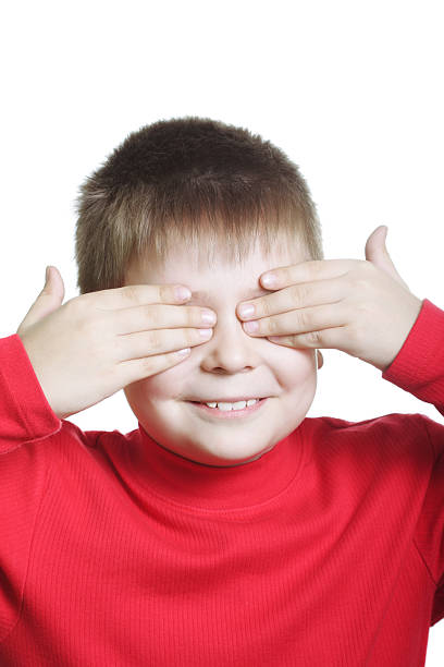 istock Smiling boy in red shutting eyes 98026127