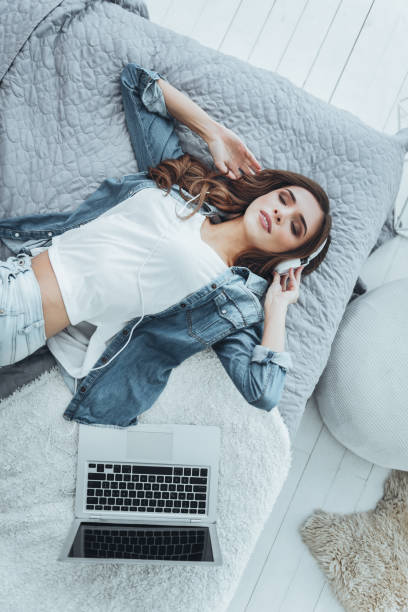 istock Nice attractive woman lying on the bed 980262634