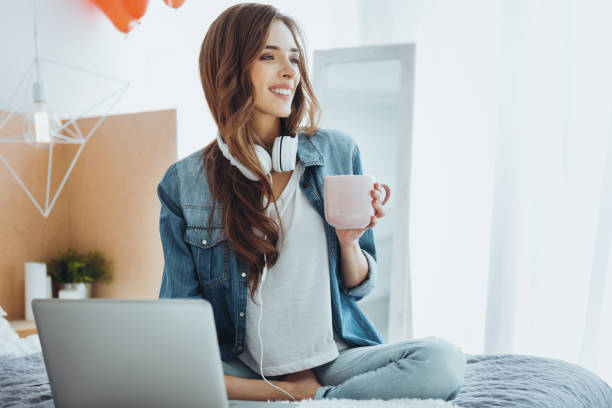 istock Nice delighted woman holding a cup of tea 980262836