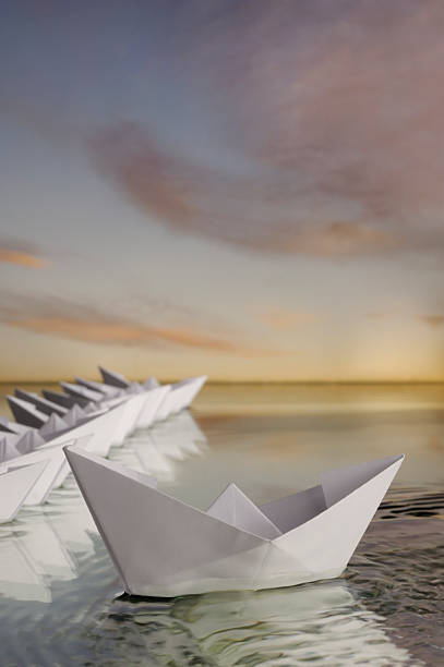 istock Out of the crowd paper boat 98026480
