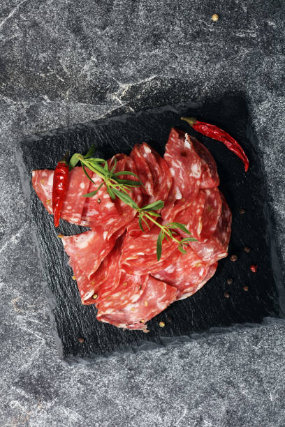 istock thinly sliced salami . delicious snack rustic salami 980268804
