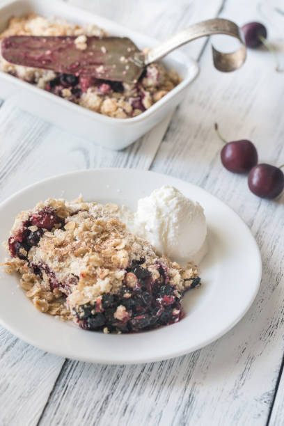 istock Portion of berry crumble with vanilla ice cream 980269012