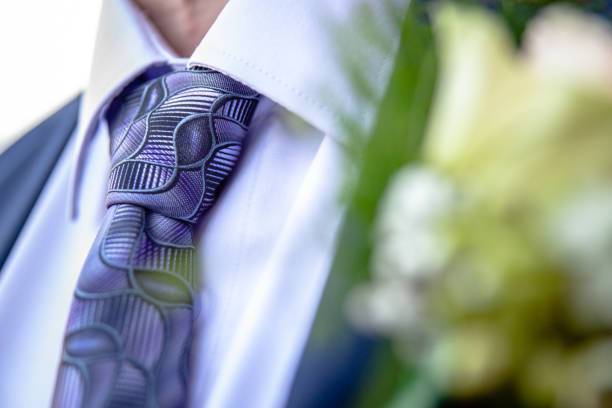 Stylish neckties as a frame on wooden background. Top view, copy space.