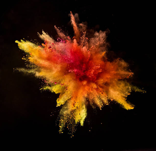 istock Colored powder explosion isolated on black background 980300664