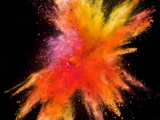 istock Colored powder explosion isolated on black background 980300810