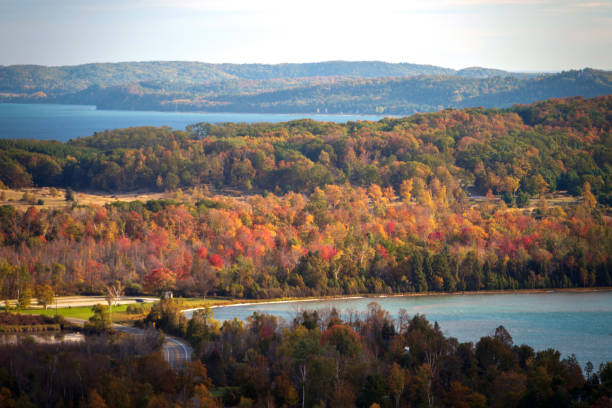Early morning autumn light near Traverse City, Michigan. Photo taken on a calm tranquil colorful morning during the peak autumn foliage season. Michigan's beautiful fall foliage ranks with the best in New England bringing out some of the most colorful foliage in the United States