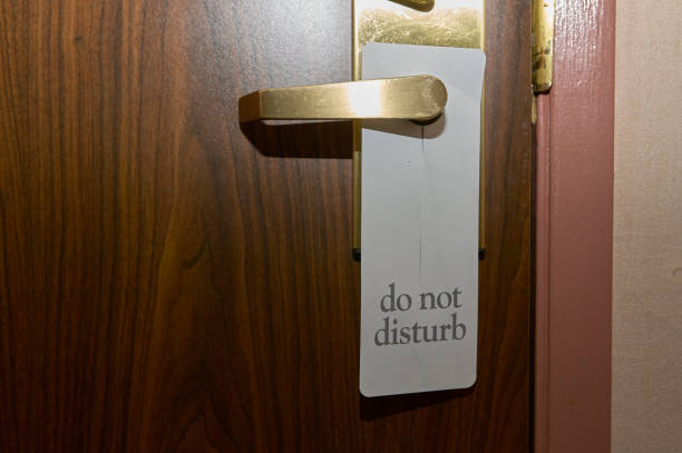 istock Do Not Disturb sign on a hotel door 980304240