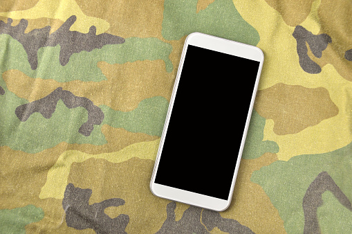phone on a camouflage or military fabric