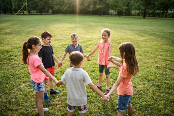 istock Children making circle in nature 980307472