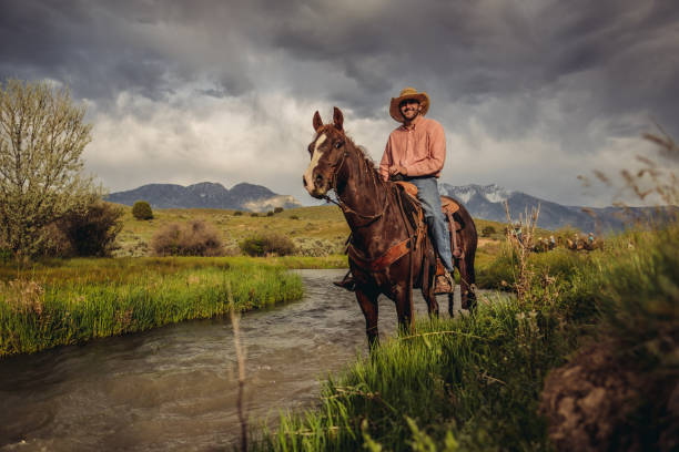 istock Utah Cowboy riding across the river 980307636