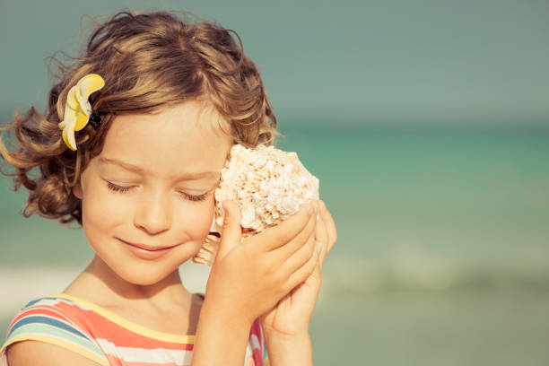 istock Child relaxing on the beach 980310200