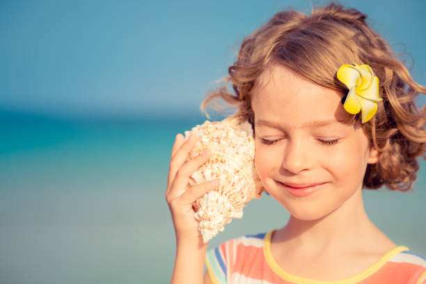 istock Child relaxing on the beach 980310210