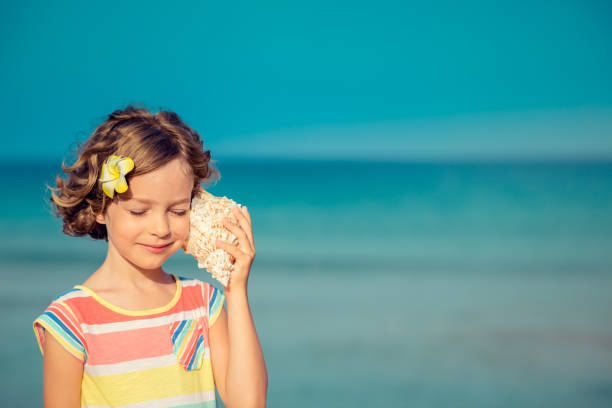 istock Child relaxing on the beach 980310212