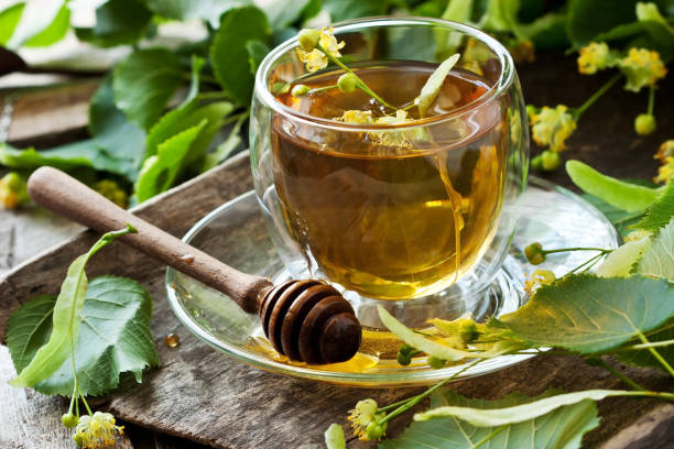 istock Linden tea in  transparent glass 980310400
