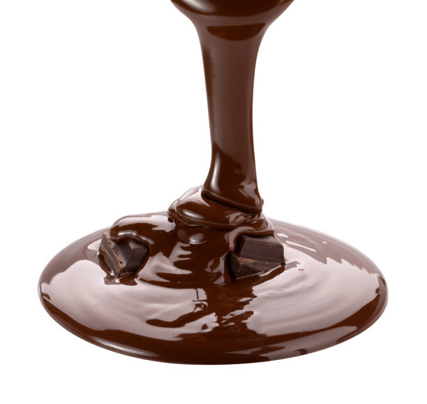 istock Melted chocolate flowing. Isolated on white background with clipping path 980313734