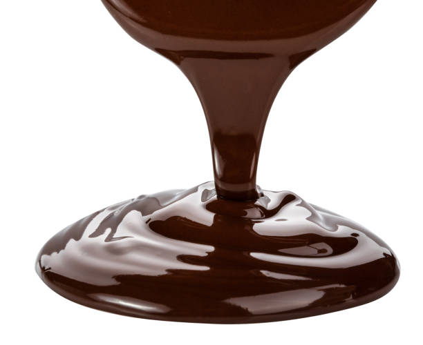 istock Melted chocolate flowing. Isolated on white background with clipping path 980313740