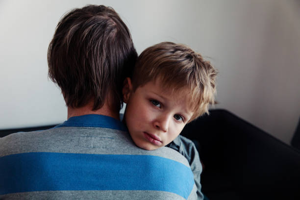istock Father comforting sad child, parenting, sorrow 980317532