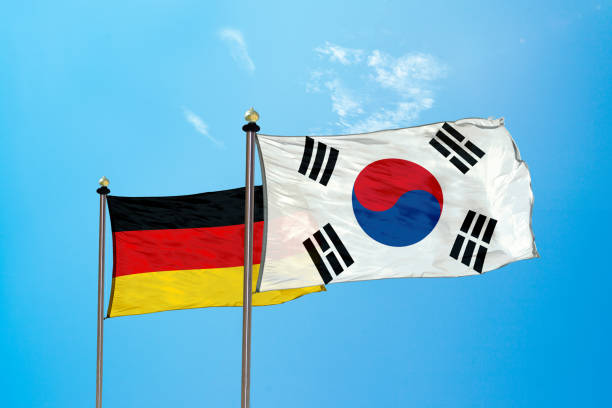 istock Germany vs South Korea flag on the mast 980321884